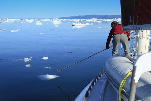 Jess pushing the ice away with a boat hook ©  SW